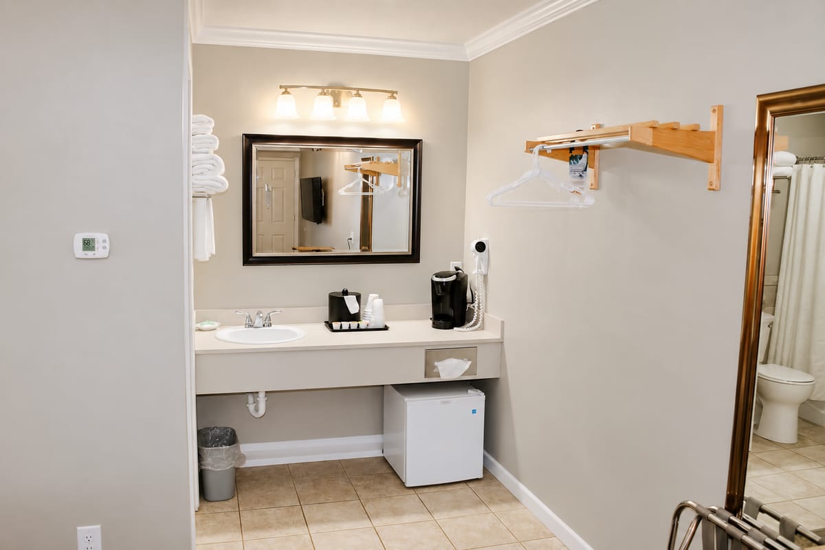 Wide vanity with mirror and lighting